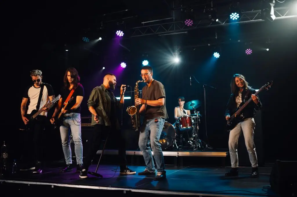 Music band playing live on stage during a concert