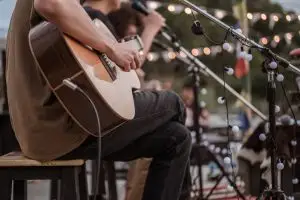 The musician plays and the lead singer sings on stage at the music festival. Concert,mini concert and music festivals.