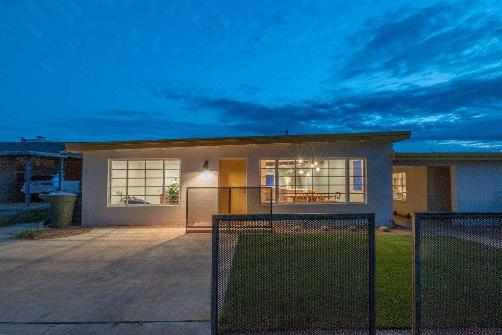 Mid-century modern home in Tucson - clean lines, simplicity in design, yellow door and large divided windows
